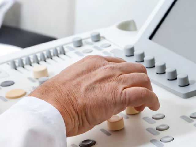 healthcare professional reviewingdata on medical system