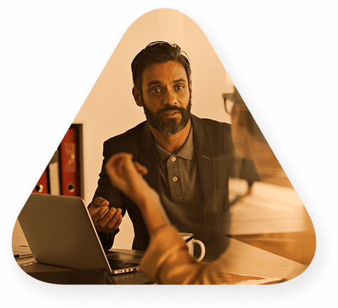 Two people sitting in an office and discussing talent services and staffing