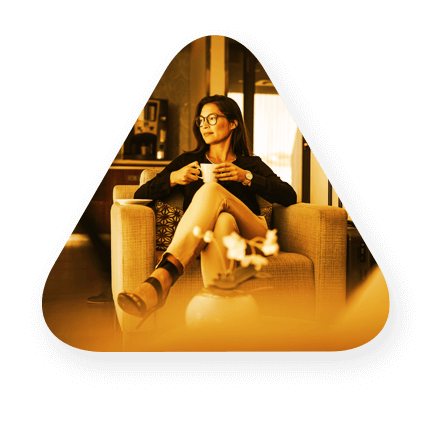 a woman drinking coffee at a hotel