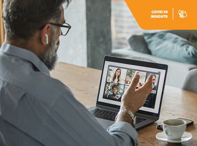 profesionally collaborates with his team using video conferencing during the COVID-19 pandemic