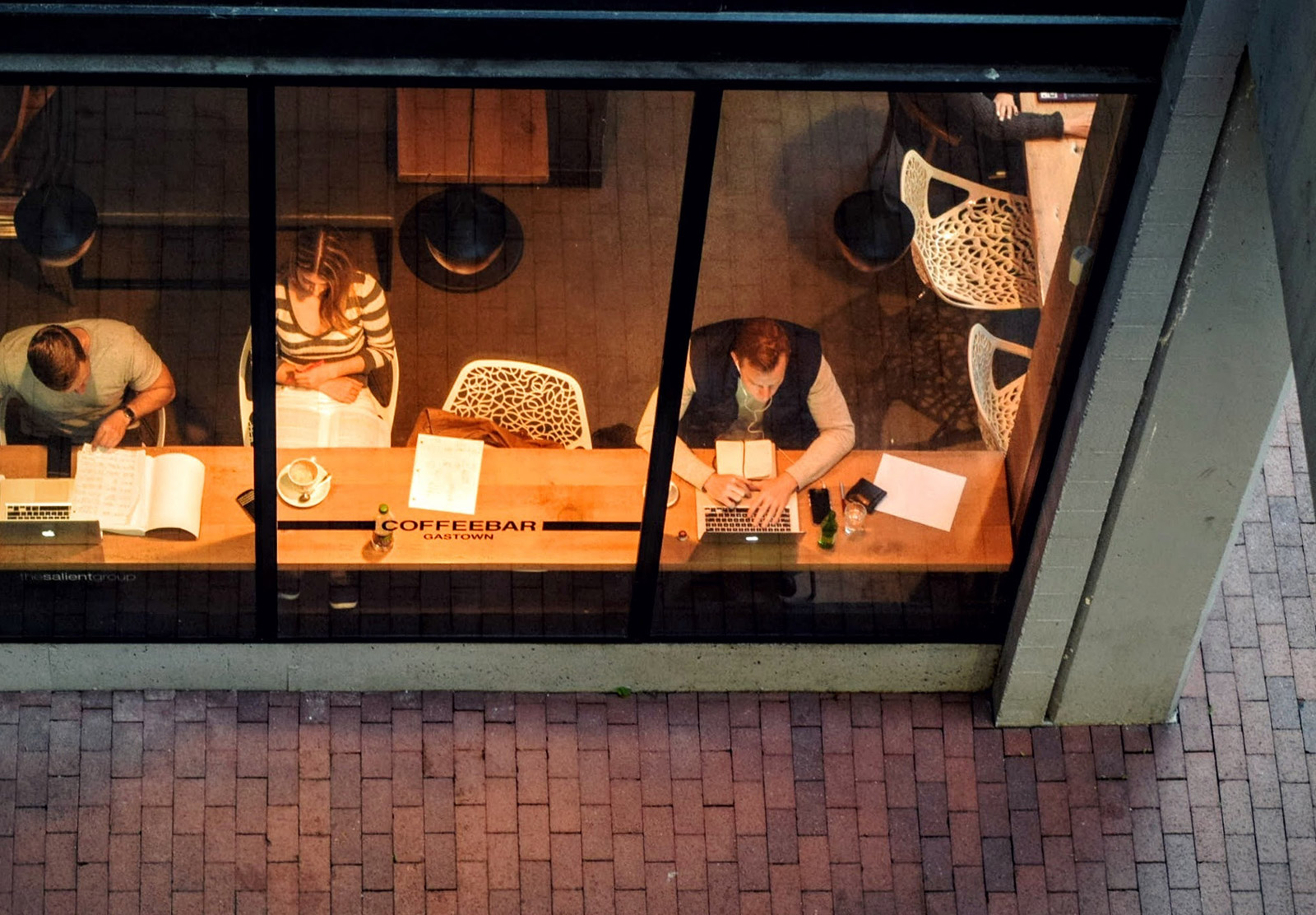 People on laptops in cafe