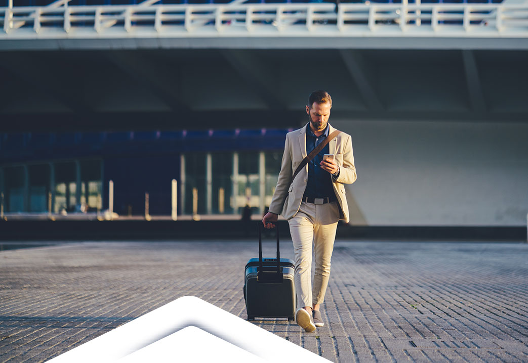man checking email while traveling