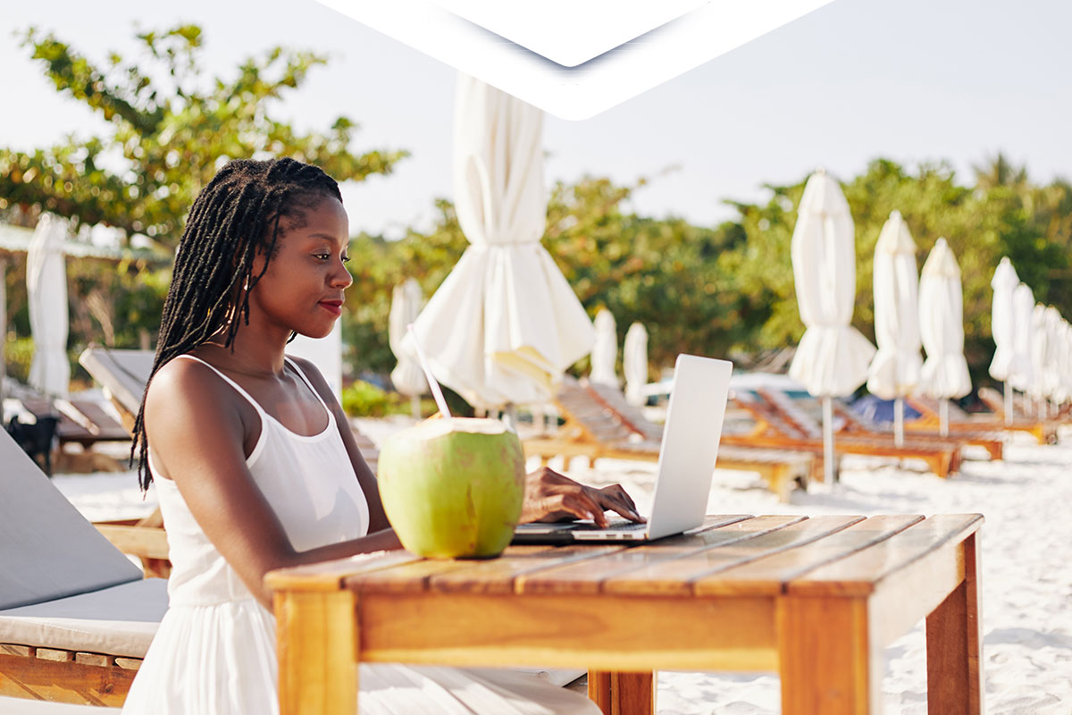 woman working while at the beach