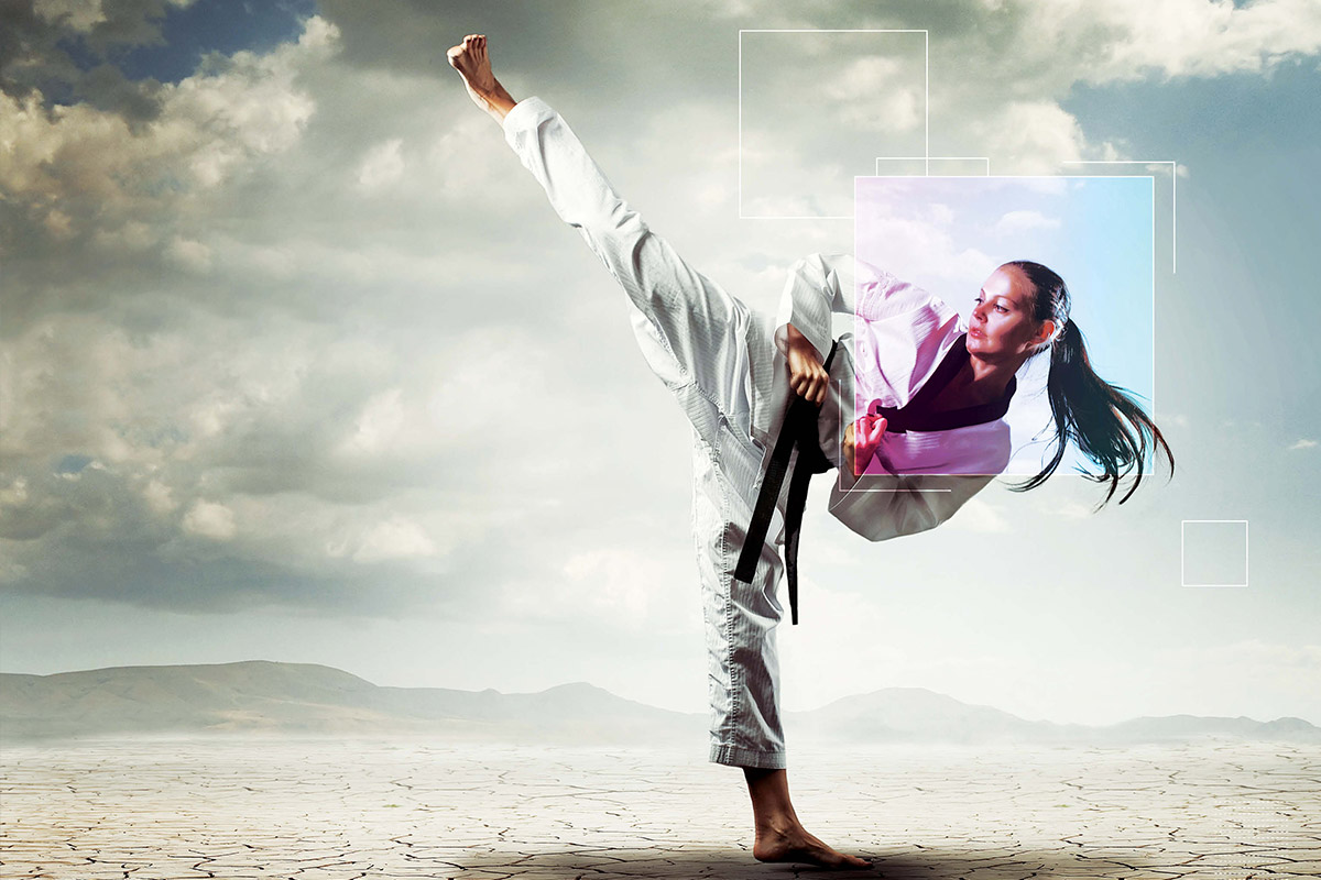 woman with blackbelt kicking