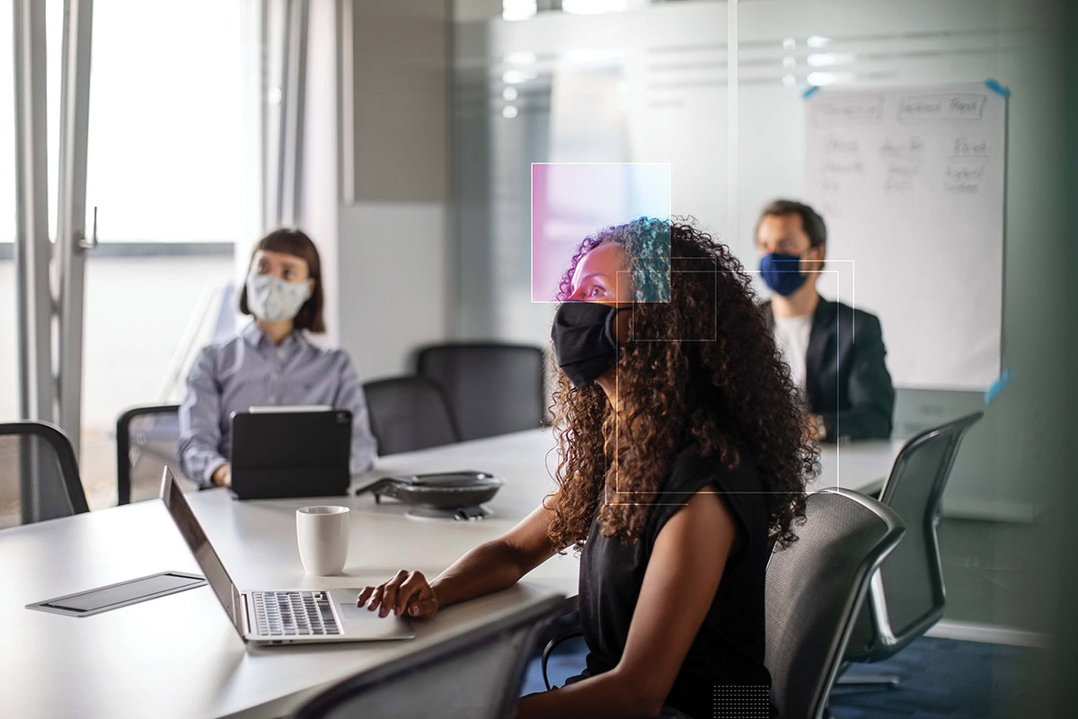 business people in conference room wearing masks