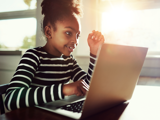 young girl using a laptop