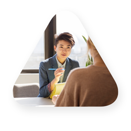 Woman taking notes in an interview