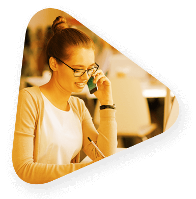 a student talking on her cell phone and smiling