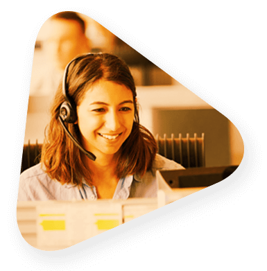 a customer support employee wearing a headset and smiling