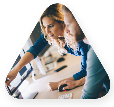 male and female analyst reviewing data dashboard