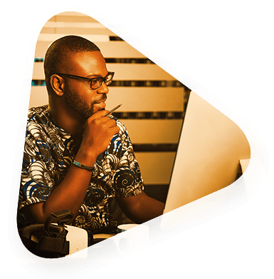 a man in a Global Services career looking at a computer screen