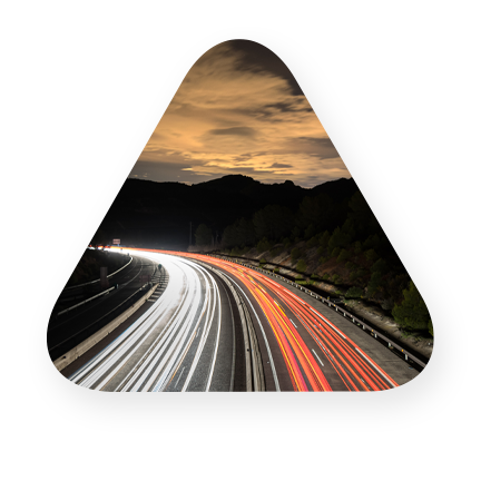 curved highway with neon lights representing speed