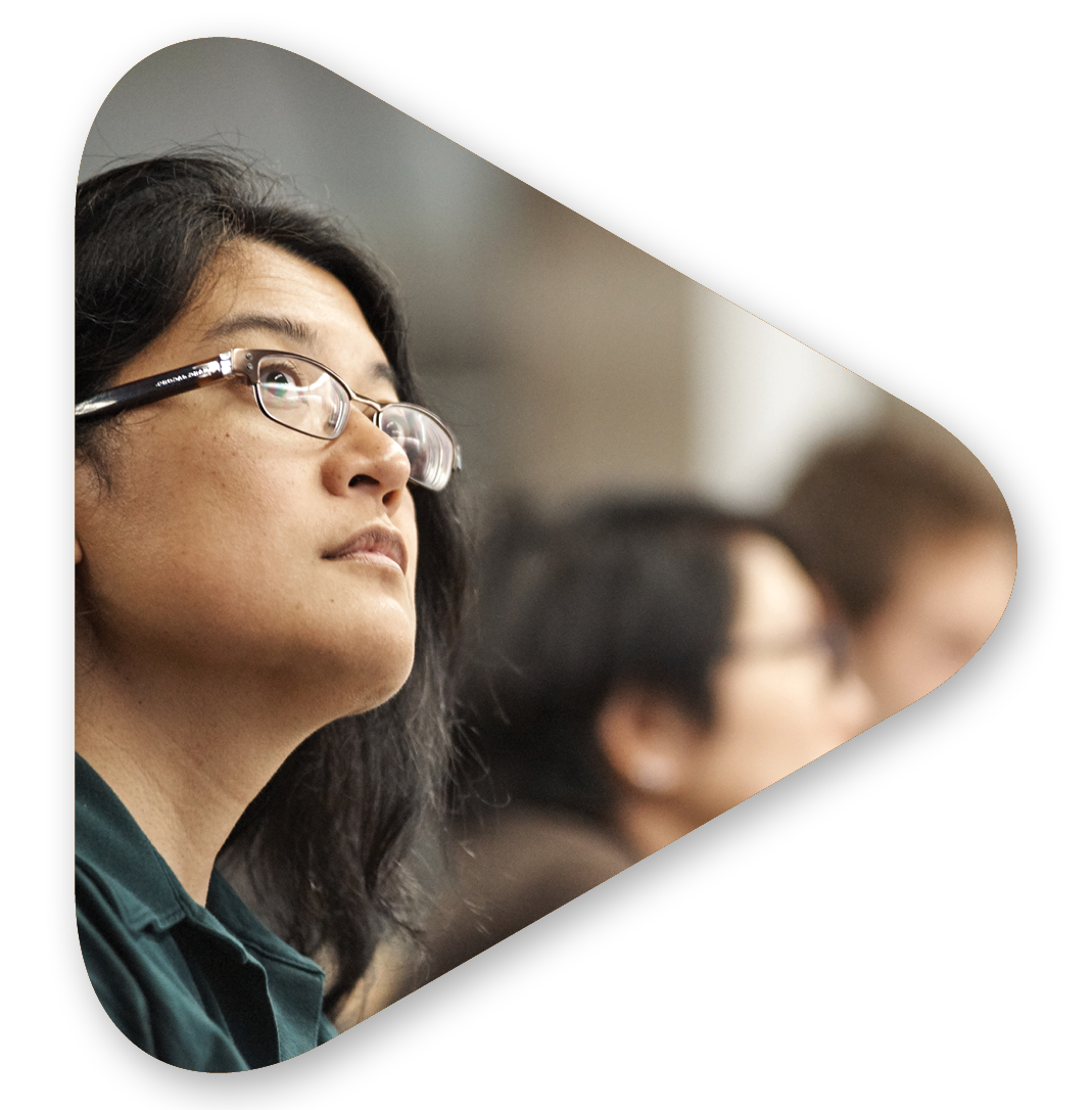A Per Scholas student looks up into the distance