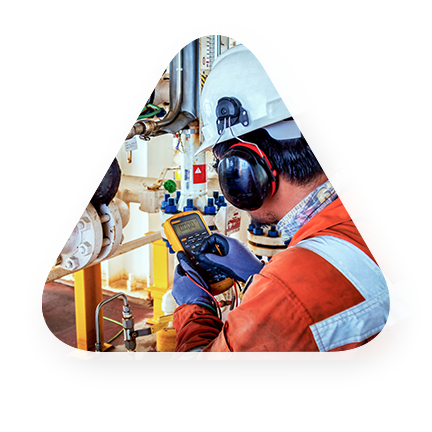 employee in full gear checks gas gauges