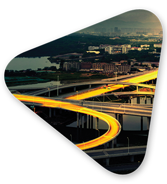 A lit highway on an interchange alluding to how information flows with strong data analytics solutions