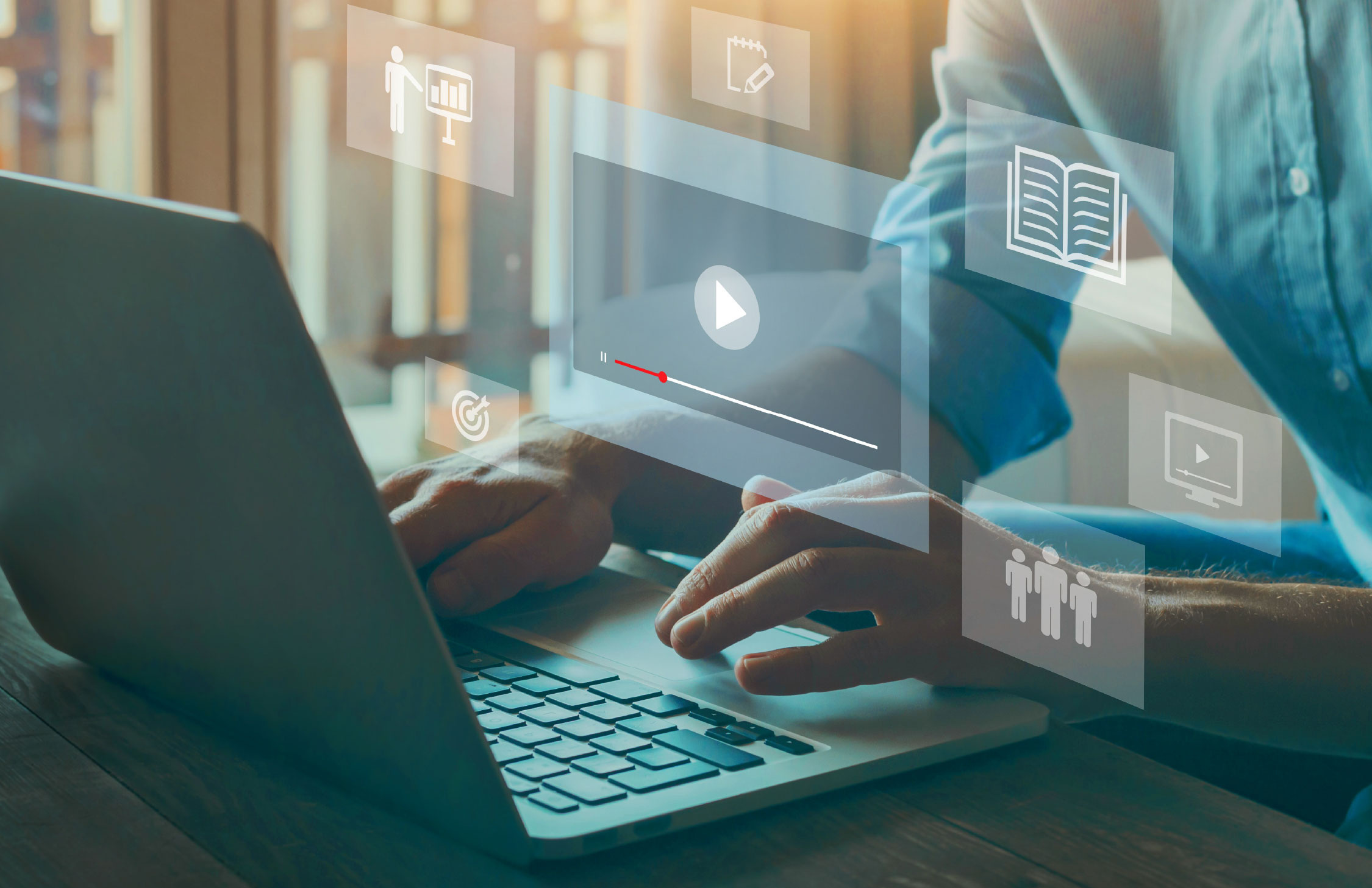 image of person working on laptop computer device with an abstract overlay of the screen showing a video playing
