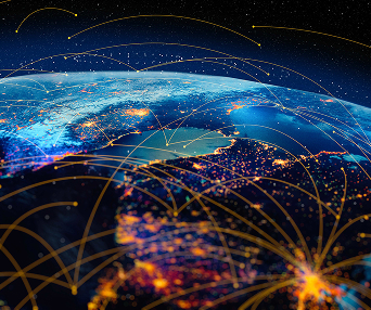 A digital representation of Earth from space at night, showing illuminated cities and interconnected lines symbolizing global communication networks.