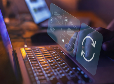 laptop open with digital data migration icons