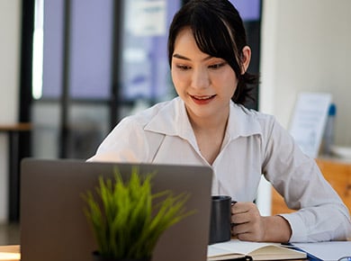Lady working on laptop.