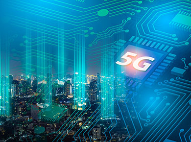 An illustration of a 5G chip superimposed on a cityscape at night