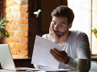 individual reviewing receipts while completing tax paperwork