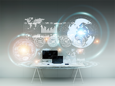 A desk with a computer and digital displays highlighting the post-pandemic world of work