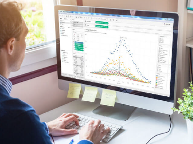 Man viewing Tableau visualization on computer screen