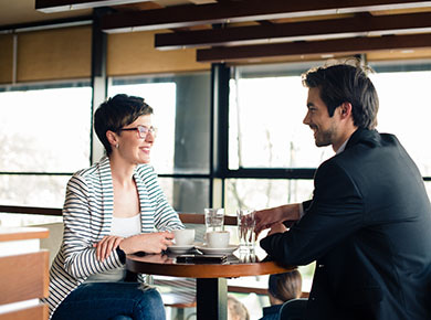 A consultant and a recruiter having coffee while building a better partnership with each other
