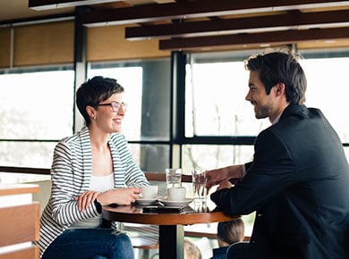 A consultant and a recruiter having coffee while building a better partnership with each other