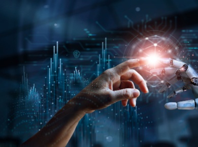 Demand for AI - human hand reaching out to a robotic hand