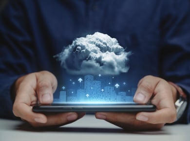Digital stormy clouds over tablet and city scene