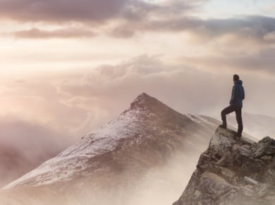 Cloud Journey and Self Discovery - A man peering over a vista of peaks in the clouds
