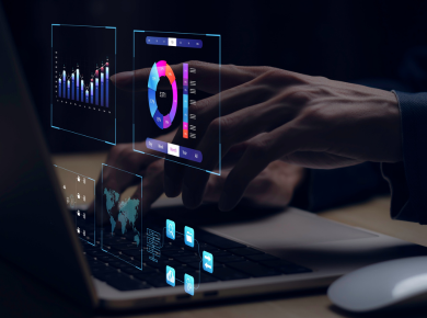 a close-up of a laptop with hands on the keyboard and digital image of graphs and charts
