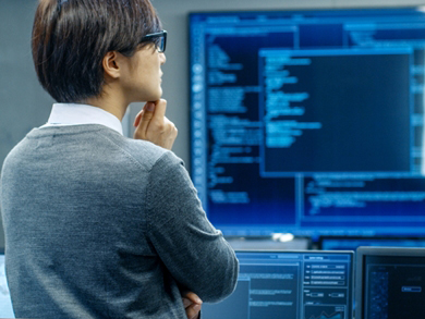 AI pro looks at a many blue computer screens