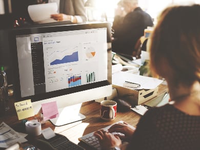 woman works on a desktop on business intelligence visualization