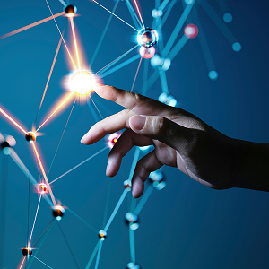 A hand reaching toward a glowing point within a network of connected lines and nodes.