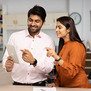 Engineers reviewing AI-enabled automation insights to improve site performance, operational efficiency and remote device management.