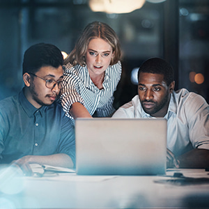 Marketing and technology professionals collaborating to optimise digital customer experiences.