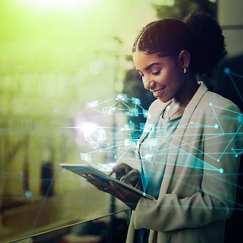 Person using a tablet with holographic visuals projected from it.