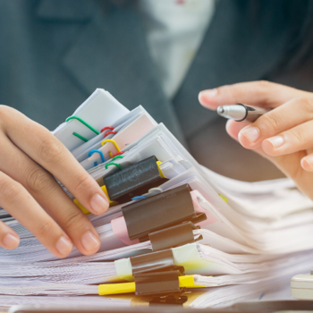 A professional handling medical record files