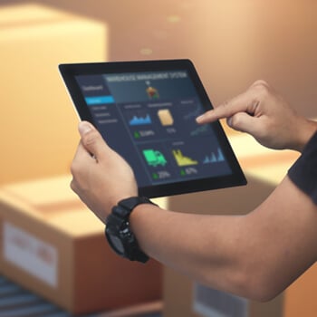 A person using an iPad to log transportation progress