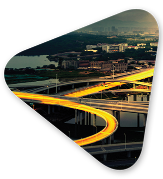A lit highway on an interchange alluding to how information flows with strong data analytics solutions