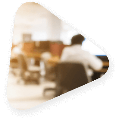 Blurred photo of someone sitting in a conference room