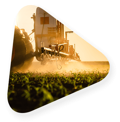 farming tractor and equipment working in a produce field