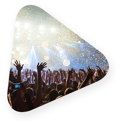 A crowd in front of a stage in the middle of a show