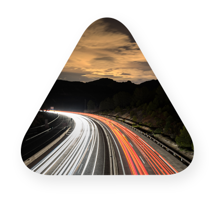 curved highway with neon lights representing speed