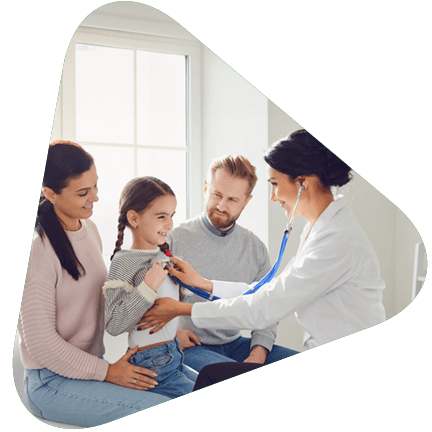 A doctor with a young patient and family