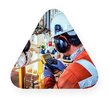 employee in full gear checks gas gauges