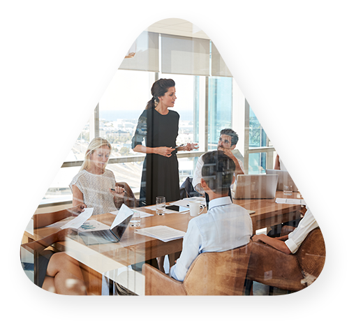 conference room meeting viewed through a glass door.