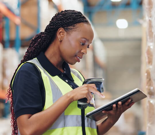 A warehouse worker using a modern application technology